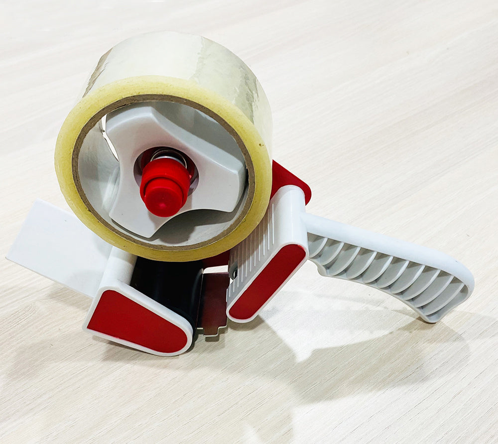 Ergonomic tape dispenser with retractable cutter