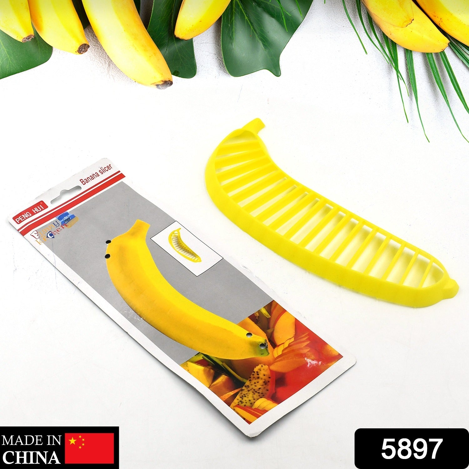 Banana slicer cutter, plastic, with handle for slicing fruit for salads.